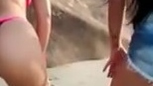 Summer in Brazil - Two sluts wiggling the ass on the beach.